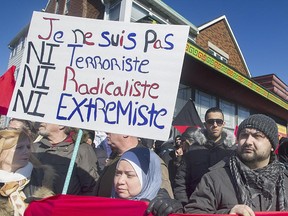 Members of the Muslim community attend a demonstration to denounce PEGIDA, an international anti-Islam group, in Montreal, Saturday, March 28, 2015.