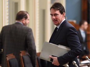 Parti Québécois leadership candidate and Opposition MNA Pierre-Karl Péladeau walks to his seat Thursday, March 19, 2015 at the legislature in Quebec City. Péladeau made comments on ethnics during a leadership candidates debate on Wednesday night, March 18.
