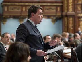 Quebec Opposition MNA Pierre Karl Peladeau speaks during question period, Tuesday, March 31, 2015 at the legislature in Quebec City.