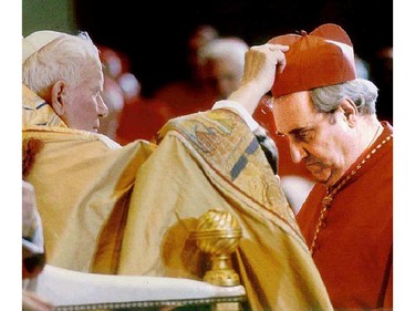 On March 2, 1996, Pope John Paul places a biretta, the red hat of a Cardinal on Montrealer Jean-Claude Turcotte at the Vatican.