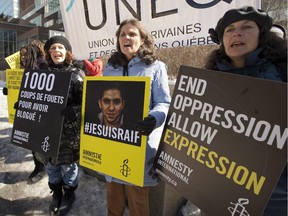 Supporters of Raif Badawi take part in a rally for his freedom Thursday, March 12, 2015 in Montreal. Badawi was sentenced  to 10 years in prison, 1,000 lashes and a fine of one million Saudi Arabian riyals (about $315,000 Cdn) for offences including creating an online forum for public debate and insulting Islam.