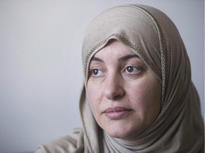 Rania El-Alloul poses for a photograph at her home in Montreal on February 28, 2015. A crowdfunding campaign in support of El-Alloul who was refused her day in court, because she was wearing a hijab, has raised over $50,000. The campaign was launched to help Rania El-Alloul buy a car.
