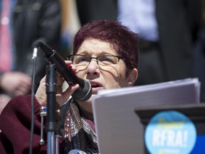 Annette Gross, of Indianapolis, addresses the crowd as one of the organizers of the rally. Thousands of opponents of Indiana Senate Bill 101, the Religious Freedom Restoration Act, gathered on the lawn of the Indiana State House to rally against that legislation Saturday, March 28, 2015.  Indiana's law has been widely criticized by businesses and organizations around the country.