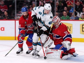 Tomas Hertl of the San Jose Sharks picks up the rebounding puck in front of Carey Price of the Montreal Canadiens during the NHL game at the Bell Centre on March 21, 2015, in Montreal.