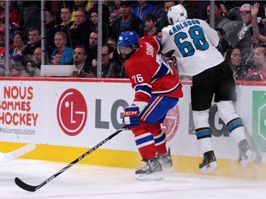 P.K. Subban #76 of the Montreal Canadiens escapes a body check by Melker Karlsson #68 of the San Jose Sharks during the NHL game at the Bell Centre on March 21, 2015, in Montreal.