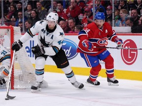 Marc-Edouard Vlasic #44 of the San Jose Sharks skates with the puck while being chased by Tomas Plekanec during game at the Bell Centre on March 21, 2015.