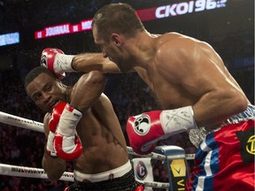 Sergey Kovalev lands a right to the head of Jean Pascal during their light-heavyweight title fight at the Bell Centre on March 14, 2015. Kovalev defended his World Boxing Association, International Boxing Federation and World Boxing Organization titles with a TKO victory.