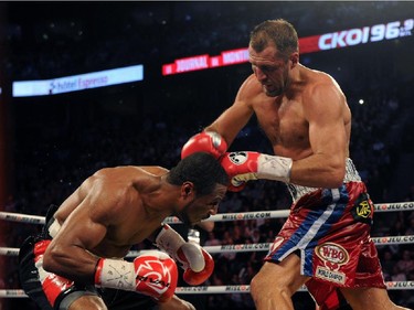 Sergey Kovalev (right) lands a punch to the head of Jean Pascal during their unified light heavyweight championship bout at the Bell Centre on March 14, 2015 in Montreal, Quebec, Canada.