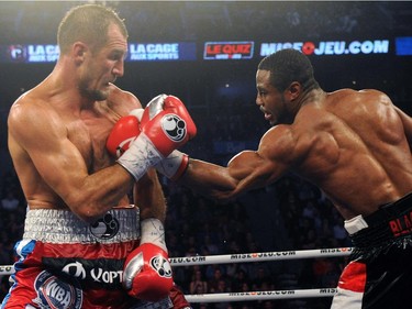 Jean Pascal (right) lands a body shot on Sergey Kovalev during their unified light heavyweight championship bout at the Bell Centre on March 14, 2015 in Montreal, Quebec, Canada.