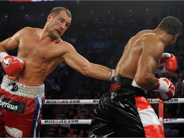 Sergey Kovalev (left) lands a body shot on Jean Pascal during their unified light heavyweight championship bout at the Bell Centre on March 14, 2015 in Montreal, Quebec, Canada.