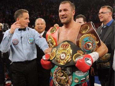 Sergey Kovalev stands with all the belts after defeating Jean Pascal (not pictured) during their Unified light heavyweight championship bout at the Bell Centre on March 14, 2015 in Montreal, Quebec, Canada.