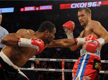 Sergey Kovalev (right) dodges a body shot by Jean Pascal during their unified light heavyweight championship bout at the Bell Centre on March 14, 2015 in Montreal, Quebec, Canada.