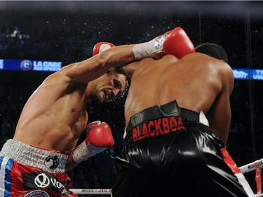 Sergey Kovalev (left) lands a head shot on Jean Pascal during their unified light heavyweight championship bout at the Bell Centre on March 14, 2015 in Montreal, Quebec, Canada.