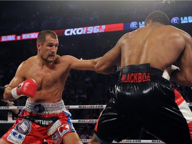 Sergey Kovalev (left) lands a body shot to Jean Pascal during their unified light heavyweight championship bout at the Bell Centre on March 14, 2015 in Montreal, Quebec, Canada.