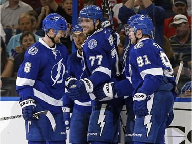 Tampa Bay Lightning's Victor Hedman (77) celebrates his goal with teammates, including Anton Stralman (6) and Steven Stamkos during the second period against the Montreal Canadiens Monday, March 16, 2015, in Tampa, Fla.
