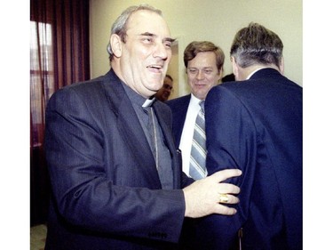 Newly appointed Cardinal Jean Claude Turcotte has a laugh with some friends after speaking with the press Monday.