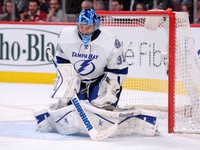 Ben Bishop of the Tampa Bay Lightning stops puck at the Bell Centre on Tuesday, March 10, 2015.