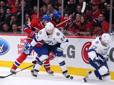 Tomas Plekanec (14) and P.K. Subban (76) of the Montreal Canadiens battle for the puck against Ryan Callahan of the Tampa Bay Lightning at the Bell Centre on Tuesday, March 10, 2015.