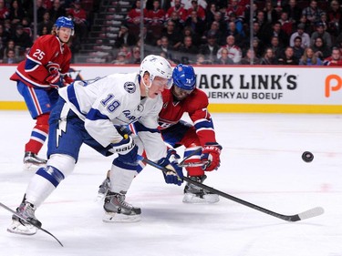 Ondrej Palat of the Tampa Bay Lightning and P.K. Subban of the Montreal Canadiens chase the puck at the Bell Centre on Tuesday, March 10, 2015.