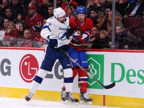 Alex Killorn of the Tampa Bay Lightning body checks Jeff Petry of the Montreal Canadiens at the Bell Centre on Tuesday, March 10, 2015.