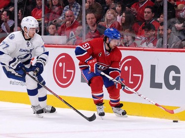 David Desharnais skates with the puck while being chased by Victor Hedman of the Tampa Bay Lightning at the Bell Centre on Tuesday, March 10, 2015.