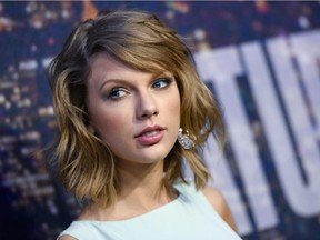 FILE - In this Feb. 15, 2015 file photo, singer Taylor Swift attends the SNL 40th Anniversary Special in New York. Swift, Microsoft Corp. Harvard University are among those buying up .porn and .adult Web suffixes as a pre-emptive move before those domain names become available this summer. The Internet Corporation for Assigned Names and Numbers, or ICANN, is making Internet address suffixes beyond the usual .com or .org available for people and businesses to use.