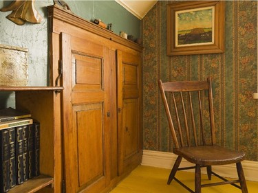 The master bedroom has a closet hidden behind wardrobe doors. The wallpaper and bed covers were chosen with great care to reflect the period.
