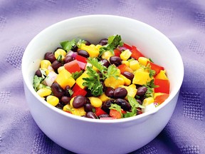 This easy salad combines canned vegetables with fresh fruit and vegetables and a spicy dressing.
