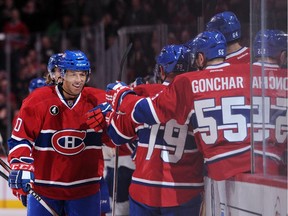 The Canadiens' Manny Malhotra is congratulated by his teammates after scoring his first goal of the season in a 4-0 win over the Toronto Maple Leafs at the Bell Centre on  Feb. 28, 2015.