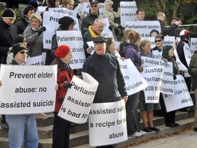 Demonstrators gather at the courthouse to show their opposition to legally assisted suicide day November 14, 2011 in Vancouver, B.C.
