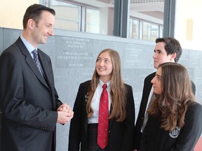 West Island College headmaster Michel Lafrance chats with students at the private college in Dollard-des-Ormeaux. The college's English division and its French division ranked No. 1 and No. 2 respectively in the 2014 MELS rankings which are based on the results of five standardized high school tests given to students in public and private schools province-wide. Photo courtesy of West Island College.
