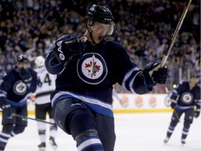 Winnipeg Jets defenceman Tyler Myers celebrates after scoring goal against the Los Angeles Kings during game on March 1, 2015.