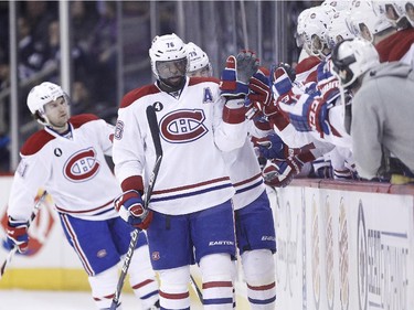 Montreal Canadiens' P.K. Subban (76) high-fives his bench after scoring against the Winnipeg Jets during second period NHL action in Winnipeg on Thursday, March 26, 2015.