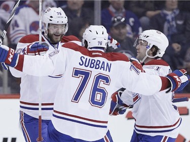 Montreal Canadiens' Andrei Markov (79). P.K. Subban (76) and David Desharnais (51) celebrate Subban's goal against the Winnipeg Jets during second period NHL action in Winnipeg on Thursday, March 26, 2015.