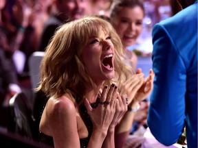 LOS ANGELES, CA - MARCH 29:  Singer/songwriter Taylor Swift (L) reacts to winning the Best Lyrics award for 'Blank Space' with singer Justin Timberlake in the audience during the 2015 iHeartRadio Music Awards which broadcasted live on NBC from The Shrine Auditorium on March 29, 2015 in Los Angeles, California.