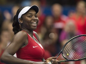 Canada's Françoise Abanda celebrates after defeating Romania's Irina-Camelia Begu in their Federal Cup tennis match in Montreal, Saturday, April 18, 2015.