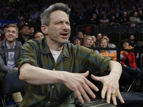 Adam Horovitz reacts to fans during the second half of an NBA basketball game between the New York Knicks and the Milwaukee Bucks on Friday, April 10, 2015, in New York. The Bucks won 99-91.
