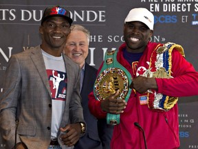 Adonis "Superman" Stevenson, right, and Sakio "The Scorpion" Bika pose for a picture at a news conference in preparation for the WBC light heavy weight championship, Wednesday, April 1, 2015 in Quebec City.