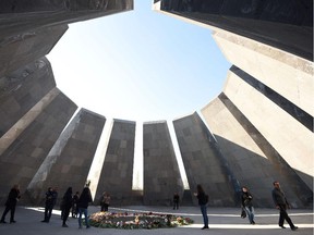 A picture taken on April 16, 2015 shows people visiting the Tsitsernakaberd Armenian Genocide Memorial in Yerevan. Armenians prepare to commemorate on April 24 a hundred years since 1.5 million of their kin were massacred by Ottoman forces, as a fierce dispute still rages with Turkey over Ankara's refusal to recognize the mass murder as genocide.