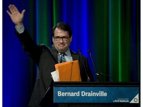 Leadership candidate Bernard Drainville waves as he enters at the beginning of a Parti Quebecois Leadership debate Thursday, April 16, 2015 in Quebec City.