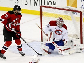 Canadiens goalie Carey Price makes a save while  Devils winger Martin Havlat lurks for a rebound on Friday, Jan. 2, in Newark, N.J. The Canadiens won 4-2.