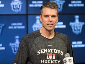Senators coach Dave Cameron talks to the media after practice at Ottawa's Canadian Tire Centre on April 22, 2015.