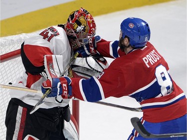 Ottawa Senators goalie Craig Anderson (41) trades cross-checks with Montreal Canadiens right wing Brandon Prust (8)during third period of Game 5 NHL first round playoff hockey action Friday, April 24, 2015 in Montreal.THE CANADIAN PRESS/Ryan Remiorz