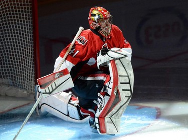 Ottawa Senators goalie Craig Anderson stretches before the first period of game 3 of first round Stanley Cup NHL playoff hockey action against the Montreal Canadiens in Ottawa on Sunday, April 19, 2015.
