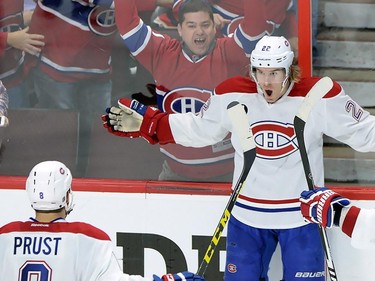 Montreal Canadiens forward Dale Weise (22) celebrates his goal against the Ottawa Senators with teammates Brandon Prust (8) and Alexei Emelin (74) during the third period of game 3 of first round Stanley Cup NHL playoff hockey action in Ottawa on Sunday, April 19, 2015.