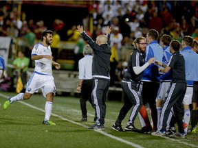 Impact of Montreal  players celebrate their goal against Liga Deportiva Alajuelense during their Concacaf Champions League semifinal match at Alejandro Morera Soto stadium in Alajuela, 25km northwest of San Jose on April 7, 2015.
