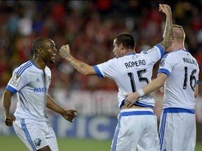 Impact players Nigel Reo-Coker,  Andres Romero and Calum Mallace celebrate a goal against Alajuelense during their CONCACAF Champions League semifinal match in Alejandro Morera Soto stadium in Alajuela on April 7, 2015.