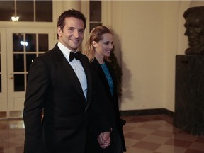 Actor Bradley Cooper, left, and Suki Waterhouse arrive at a state dinner hosted by U.S. President Barack Obama at the White House on Feb. 11, 2014 in Washington, D.C. Cooper and Waterhouse have ended their relationship.