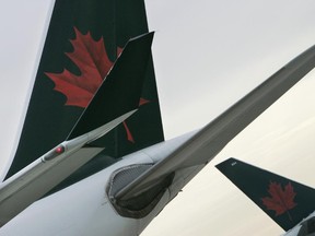 The tails of two Air Canada aircraft.