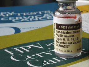 One dose of the vaccine Gardasil, developed by Merck & Co., is displayed in this Friday, Feb. 2, 2007 file photo, in Austin, Texas. A new study offers some hope that two doses of HPV vaccines may work as well as the current regimen of three.